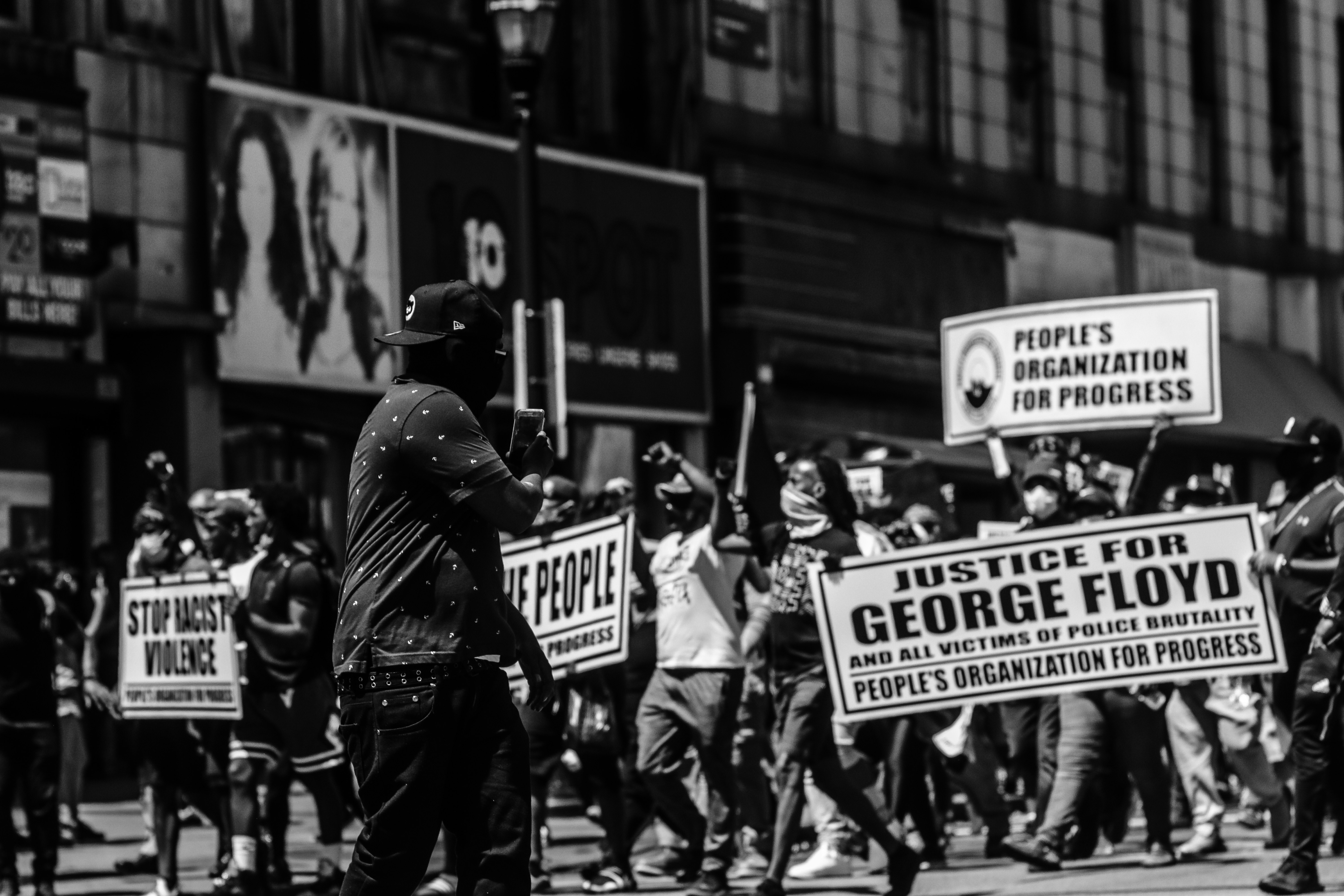 grayscale photo of people walking on street